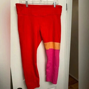 Joy lab orange leggings with stripes on one leg